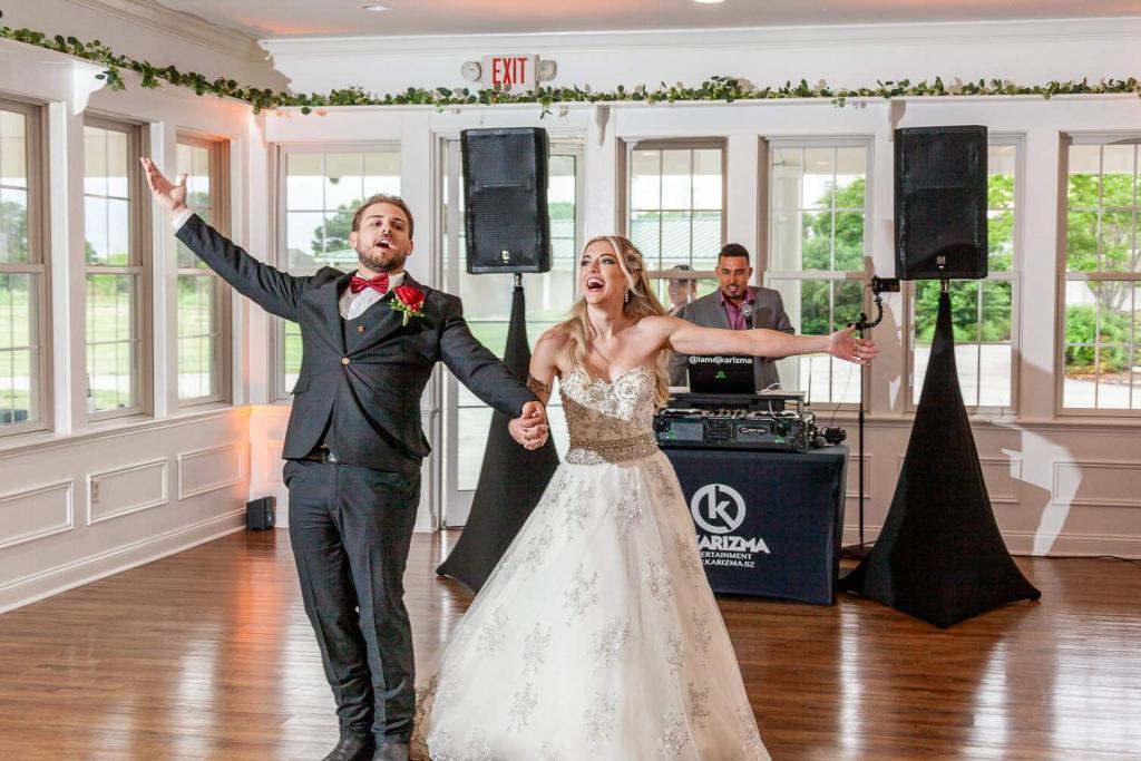 Wedding party dancing under colorful uplighting at a Norfolk Virginia reception wedding dj chesapeake virginia