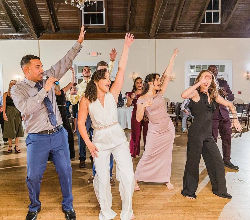 Multicultural wedding celebration with Latin, Caribbean, and hip hop music by DJ Karizma
